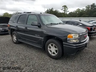 2004 GMC Yukon Denali with VIN 1GKEK63U34J116301, listed as a Copart auction lot 74930604 with 230,797 mi miles and Salvage Title. Bid and sale history available at carsss.com. Image 4.