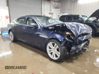2014 Jaguar XJ Portfolio with VIN SAJWJ2GD5E8V69562, listed as a Copart auction lot 87737195 with 100,525 mi miles and Salvage title. Bid and sale history available at DreamBid. Image 4.
