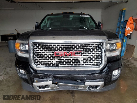2015 GMC Sierra 3500HD Denali z VIN 1GT424E85FF130203, wystawiony jako Copart lot #84489854 z przebiegiem 211 289 mil mil oraz Szkoda całkowita • Salvage title. Historia ofert i sprzedaży dostępna na DreamBid. Obrazek 5.