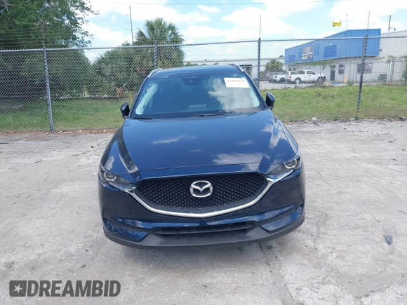 2017 Mazda CX-5 Touring with VIN JM3KFACL0H0227615, listed as a IAAI auction lot 42063618 with 72,291 mi miles. Bid and sale history available at carsss.com. Image 6.