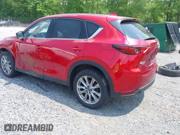 2021 Mazda CX-5 Grand Touring with VIN JM3KFBDM3M0434569, listed as a IAAI auction lot 42422349 with 25,924 mi miles and . Bid and sale history available at DreamBid. Image 3.