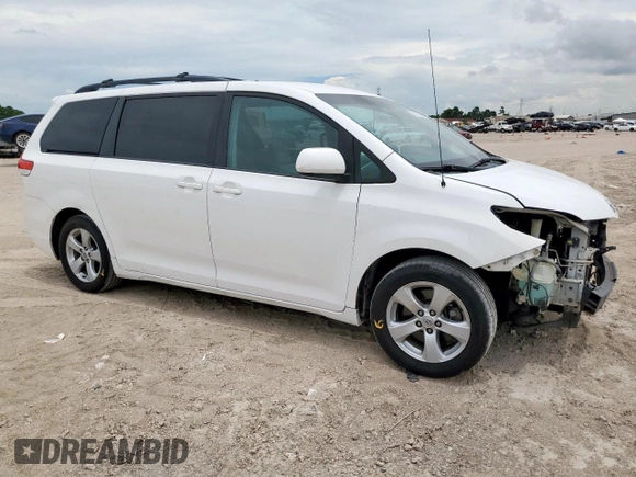2014 Toyota Sienna LE AAS with VIN 5TDKK3DC1ES424249, listed as a Copart auction lot 62114525 with 193,301 mi miles and Salvage title. Bid and sale history available at DreamBid. Image 4.