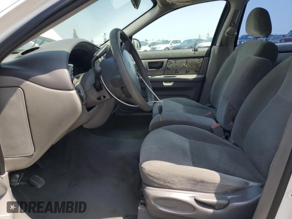 2006 Ford Taurus SE with VIN 1FAFP53U96A104173, listed as a Copart auction lot 59624865 with 145,005 mi miles and Salvage title. Bid and sale history available at DreamBid. Image 7.