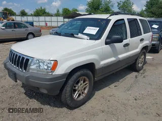 2003 Jeep Grand Cherokee Laredo z VIN 1J4GX48S33C519404, wystawiony jako IAAI lot #42164364 z przebiegiem 174 627 mil mil oraz . Historia ofert i sprzedaży dostępna na DreamBid. Obrazek 2.