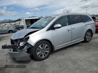 2015 Honda Odyssey Touring Elite with VIN 5FNRL5H90FB114508, listed as a Copart auction lot 51290945 with 112,330 mi miles and Salvage Title. Bid and sale history available at DreamBid. Image 1.
