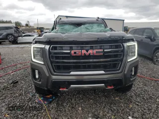2021 GMC Yukon AT4 with VIN 1GKS2CKD8MR299277, listed as a Copart auction lot 47027565 with 54,806 mi miles and Salvage Title. Bid and sale history available at carsss.com. Image 5.