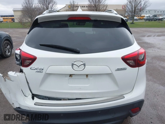 2016 Mazda CX-5 Grand Touring z VIN JM3KE4DY0G0705884, wystawiony jako IAAI lot #42016910 z przebiegiem 73 324 mil mil oraz . Historia ofert i sprzedaży dostępna na DreamBid. Obrazek 16.