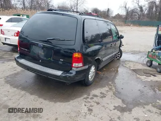 1999 Ford Windstar SE with VIN 2FMDA5243XBC41132, listed as a IAAI auction lot 41575559 with 240,497 mi miles and . Bid and sale history available at carsss.com. Image 4.