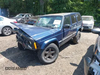 2000 Jeep Cherokee z VIN 1J4FF48S7YL120307, wystawiony jako IAAI lot #42818178 z przebiegiem 160 334 mil mil oraz . Historia ofert i sprzedaży dostępna na DreamBid. Obrazek 2.