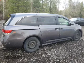 2014 Honda Odyssey Touring z VIN 5FNRL5H98EB512144, wystawiony jako Copart lot #69987533 z przebiegiem 184 231 mil mil oraz Szkoda całkowita • Salvage title. Historia ofert i sprzedaży dostępna na DreamBid. Obrazek 3.