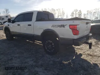 2017 Nissan Titan Pro-4X z VIN 1N6BA1F42HN571085, wystawiony jako Copart lot #49859795 z przebiegiem 163 835 mil mil oraz Tytuł czysty. Historia ofert i sprzedaży dostępna na DreamBid. Obrazek 2.