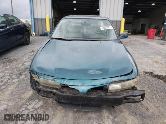 1997 Mitsubishi Galant ES z VIN 4A3AJ56G5VE019296, wystawiony jako Copart lot #56047635 z przebiegiem 87 533 mil mil oraz Szkoda całkowita • Salvage title. Historia ofert i sprzedaży dostępna na DreamBid. Obrazek 5.