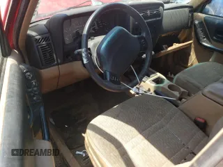 1999 Jeep Cherokee Sport z VIN 1J4FF68SXXL662401, wystawiony jako Copart lot #59698565 z przebiegiem Nie podano mil oraz Szkoda całkowita • Salvage title. Historia ofert i sprzedaży dostępna na DreamBid. Obrazek 8.