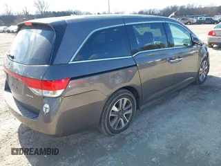 2016 Honda Odyssey Touring Elite with VIN 5FNRL5H90GB128006, listed as a IAAI auction lot 41695438 with 133,337 mi miles. Bid and sale history available at carsss.com. Image 4.