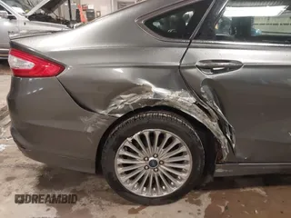 2013 Ford Fusion Titanium Hybrid with VIN 3FA6P0RU6DR319586, listed as a IAAI auction lot 42138979 with 125,388 mi miles. Bid and sale history available at carsss.com. Image 12.