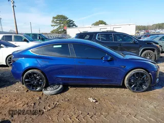 2023 Tesla Model 3 Long Range with VIN 5YJ3E1EB0PF688172, listed as a IAAI auction lot 41411580 with 21,125 mi miles and . Bid and sale history available at DreamBid. Image 13.