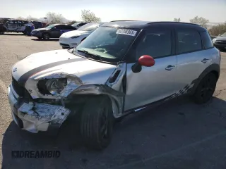 2011 MINI Countryman S with VIN WMWZC3C57BWM25669, listed as a Copart auction lot 62708965 with 98,528 mi miles and Salvage title. Bid and sale history available at DreamBid. Image 1.