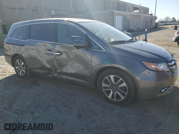 2014 Honda Odyssey Touring with VIN 5FNRL5H96EB061876, listed as a Copart auction lot 49759935 with 132,591 mi miles and Salvage Title. Bid and sale history available at DreamBid. Image 4.