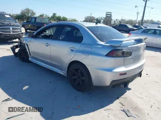 2013 Mitsubishi Lancer Evolution MR with VIN JA32W5FV6DU013470, listed as a IAAI auction lot 41544077 with 124,262 mi miles. Bid and sale history available at carsss.com. Image 3.
