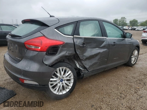 2018 Ford Focus Titanium z VIN 1FADP3N21JL295883, wystawiony jako Copart lot #59051015 z przebiegiem 43 284 mil mil oraz Szkoda całkowita • Salvage title. Historia ofert i sprzedaży dostępna na DreamBid. Obrazek 3.