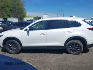 2021 Mazda CX-9 Touring z VIN JM3TCBCYXM0521323, wystawiony jako IAAI lot #42190976 z przebiegiem 56 652 mil mil oraz . Historia ofert i sprzedaży dostępna na DreamBid. Obrazek 14.