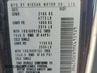 2021 Nissan NV200 SV with VIN 3N6CM0KN9MK695939, listed as a Copart auction lot 52696025 with 65,639 mi miles and Salvage title. Bid and sale history available at DreamBid. Image 14.