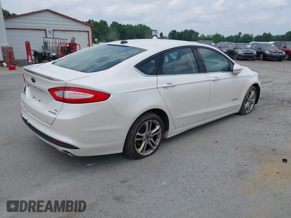 2015 Ford Fusion SE Hybrid with VIN 3FA6P0LU2FR305597, listed as a IAAI auction lot 42168292 with 97,688 mi miles and . Bid and sale history available at DreamBid. Image 4.
