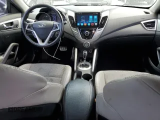 2013 Hyundai Veloster w/Black Int z VIN KMHTC6ADXDU157196, wystawiony jako Copart lot #58091015 z przebiegiem 136 201 mil mil oraz Szkoda całkowita • Salvage title. Historia ofert i sprzedaży dostępna na DreamBid. Obrazek 8.