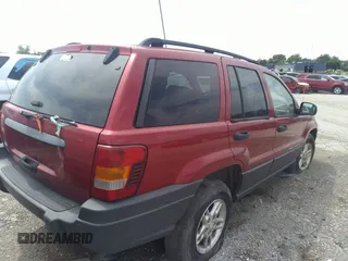 2004 Jeep Grand Cherokee Laredo with VIN 1J4GW48SX4C160475, listed as a IAAI auction lot 36500183 with 189,047 mi miles and . Bid and sale history available at DreamBid. Image 4.