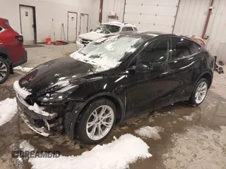 2024 Tesla Model Y Long Range with VIN 7SAYGDEEXRF085795, listed as a IAAI auction lot 41609867 with 57,049 mi miles. Bid and sale history available at carsss.com. Image 18.