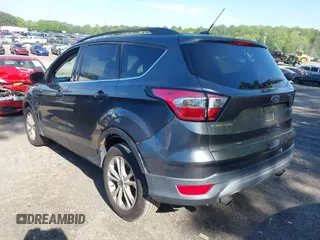 2017 Ford Escape SE z VIN 1FMCU0GDXHUB66813, wystawiony jako IAAI lot #42056150 z przebiegiem 86 915 mil mil oraz . Historia ofert i sprzedaży dostępna na DreamBid. Obrazek 3.