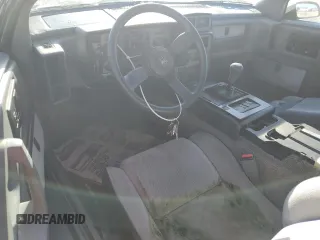 1987 Pontiac Fiero GT z VIN 1G2PG1195HP233666, wystawiony jako Copart lot #78981714 z przebiegiem Nie podano mil oraz Szkody całkowita. Historia ofert i sprzedaży dostępna na DreamBid. Obrazek 8.