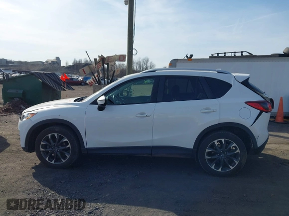 2016 Mazda CX-5 Grand Touring with VIN JM3KE4DYXG0836692, listed as a IAAI auction lot 41812584 with 119,302 mi miles. Bid and sale history available at carsss.com. Image 14.