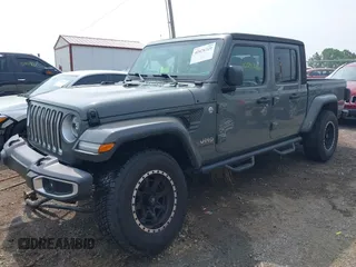 2020 Jeep Gladiator Overland with VIN 1C6HJTFG0LL169628, listed as a IAAI auction lot 42476729 with 102,874 mi miles and . Bid and sale history available at DreamBid. Image 2.