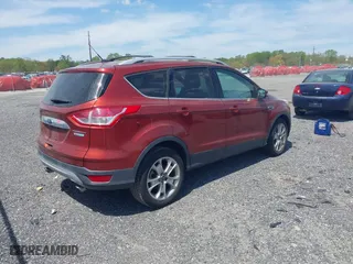 2015 Ford Escape Titanium with VIN 1FMCU0JX5FUB77475, listed as a IAAI auction lot 42103388 with 113,018 mi miles. Bid and sale history available at carsss.com. Image 4.