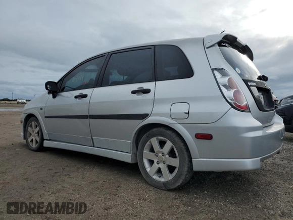 2006 Suzuki Aerio Premium z VIN JS2RC62H265351207, wystawiony jako Copart lot #74980534 z przebiegiem 64 199 mil mil oraz Nie do naprawy • Non repairable. Historia ofert i sprzedaży dostępna na DreamBid. Obrazek 2.