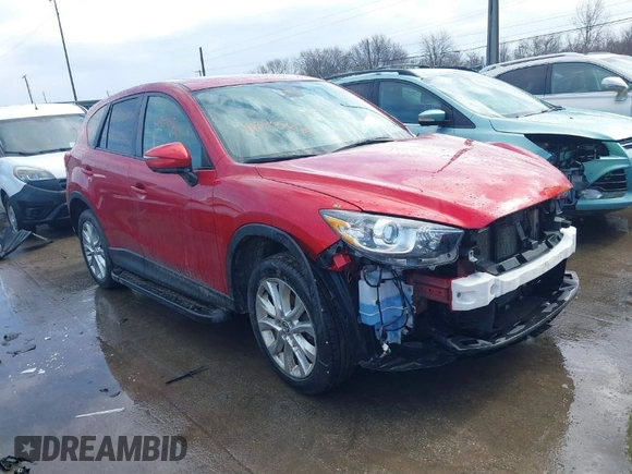 2015 Mazda CX-5 Grand Touring with VIN JM3KE4DY7F0477770, listed as a IAAI auction lot 41617849 with 106,135 mi miles. Bid and sale history available at carsss.com. Image 1.
