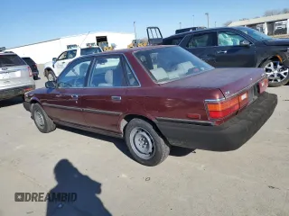 1990 Toyota Camry z VIN JT2SV21E7L3411990, wystawiony jako Copart lot #88557555 z przebiegiem 335 803 mil mil oraz Szkoda całkowita • Salvage title. Historia ofert i sprzedaży dostępna na DreamBid. Obrazek 2.