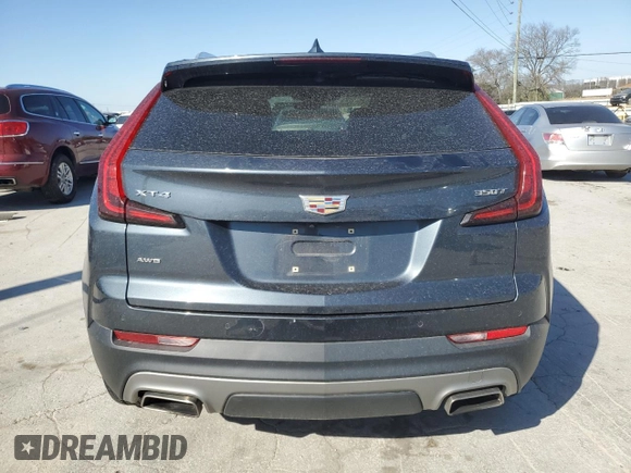 2021 Cadillac XT4 AWD Premium Luxury with VIN 1GYFZDR47MF002175, listed as a Copart auction lot 48303665 with 94,698 mi miles and Salvage Title. Bid and sale history available at carsss.com. Image 6.