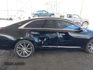 2013 Cadillac XTS Luxury with VIN 2G61P5S35D9105460, listed as a IAAI auction lot 42582313 with 144,895 mi miles and . Bid and sale history available at DreamBid. Image 6.
