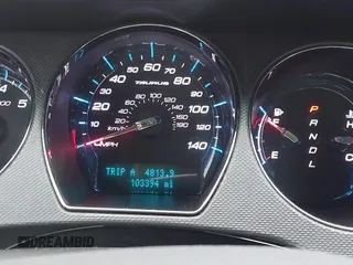 2011 Ford Taurus SE with VIN 1FAHP2DW2BG181059, listed as a IAAI auction lot 42036867 with 103,394 mi miles. Bid and sale history available at carsss.com. Image 7.