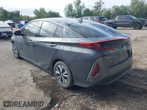 2018 Toyota Prius Plus with VIN JTDKARFPXJ3104302, listed as a IAAI auction lot 42127312 with 87,531 mi miles and . Bid and sale history available at DreamBid. Image 3.