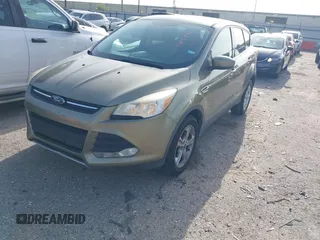 2013 Ford Escape SE z VIN 1FMCU0GX2DUD94471, wystawiony jako IAAI lot #42655476 z przebiegiem 146 578 mil mil oraz . Historia ofert i sprzedaży dostępna na DreamBid. Obrazek 2.