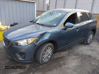 2016 Mazda CX-5 Touring with VIN JM3KE4CY5G0771252, listed as a IAAI auction lot 42138637 with 106,767 mi miles and . Bid and sale history available at carsss.com. Image 2.