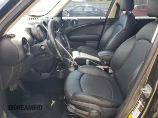 2014 MINI Countryman S with VIN WMWZC3C57EWP25099, listed as a Copart auction lot 62646555 with 153,059 mi miles and Salvage title. Bid and sale history available at DreamBid. Image 7.