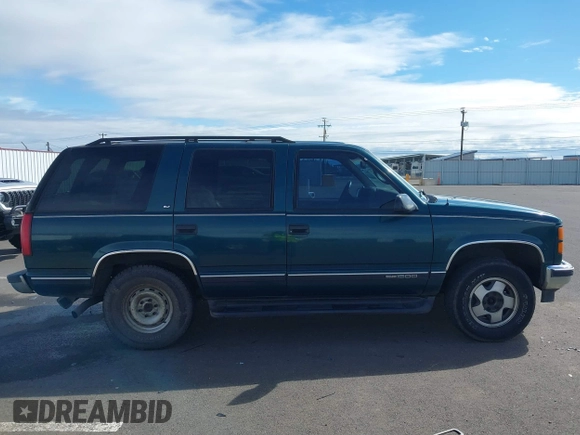 1999 GMC Yukon with VIN 1GKEK13R3XJ717999, listed as a IAAI auction lot 41870187 with 179,855 mi miles. Bid and sale history available at carsss.com. Image 13.