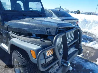 1999 Jeep Wrangler Sport with VIN 1J4FY19SXXP456810, listed as a IAAI auction lot 41725834 with 93,151 mi miles. Bid and sale history available at carsss.com. Image 6.