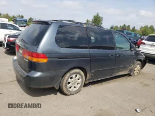 2003 Honda Odyssey EX-L z VIN 5FNRL18053B123100, wystawiony jako Copart lot #54159715 z przebiegiem 232 206 mil mil oraz Szkoda całkowita • Salvage title. Historia ofert i sprzedaży dostępna na DreamBid. Obrazek 3.