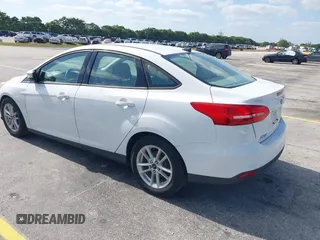 2015 Ford Focus SE with VIN 1FADP3F23FL329375, listed as a IAAI auction lot 42170945 with 114,180 mi miles. Bid and sale history available at carsss.com. Image 3.