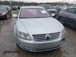 2005 Volkswagen Phaeton z VIN WVWBH03D858004483, wystawiony jako IAAI lot #41412475 z przebiegiem 146 072 mil mil oraz . Historia ofert i sprzedaży dostępna na DreamBid. Obrazek 12.